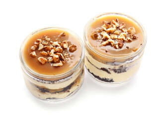 Delicious cupcakes in jars on white background
