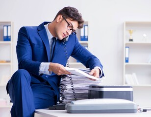 Businessman making copies in copying machine