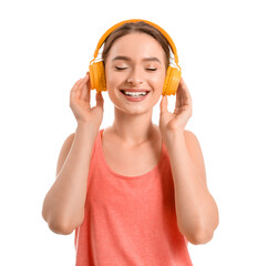 Sporty young woman with headphones on white background