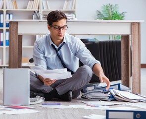 Bankrupt businessman angry in the office floor