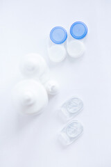 Contact lenses lens care products in white bottles on white background lens containers (lens case)