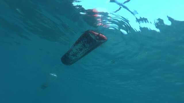 Marker beach buoys on the Mogren beach, Budva, Adriatic Sea, Montenegro, Europe. (4K - 60 fps) underwater view. 