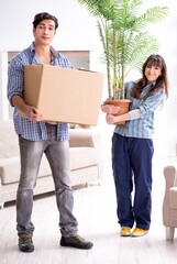 Young family moving in to new apartment after paying off mortgag