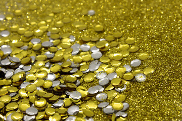 Silver and Gold sequins on a glittery background