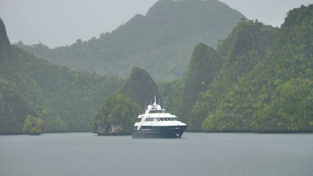 Luxury Live Aboard Yacht Anchored in Storm, Wayag Islands, Raja Ampat