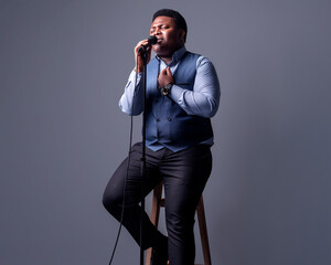 musician Pop singer singing a song in the recording Studio background