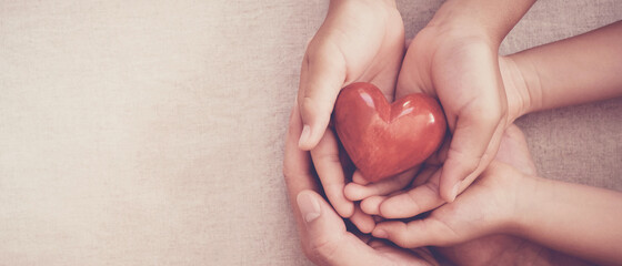 hands holding red heart, heart health, charity volunteer donation, CSR responsibility, world heart...