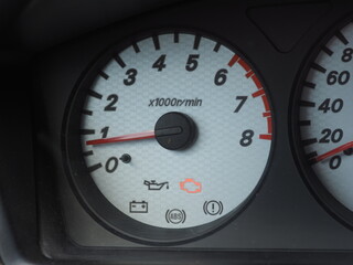 car tachometer panel with active engine diagnostics indicator