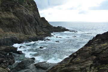 Fototapeta na wymiar Danao beach resort rock formation and sea water