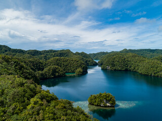 Fototapeta na wymiar Aerial shot of tropical rock islands in calm tranquil secluded bay in Palau Micronesia