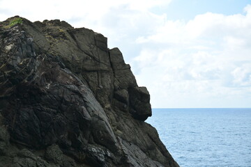 Fototapeta na wymiar Danao beach resort rock formation and sea water