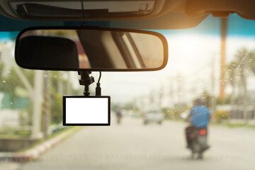 Close up car on highway at sunset, with video recorder next to a rear view mirror,video recorder driving a car on highway,car video recorder,Full HD camera recorder for vehicle.