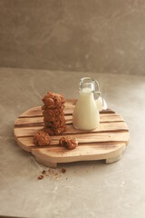 chocolate cookies with white milk on the table.