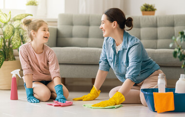 family cleaning the room