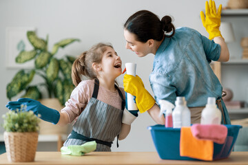 family cleaning the room