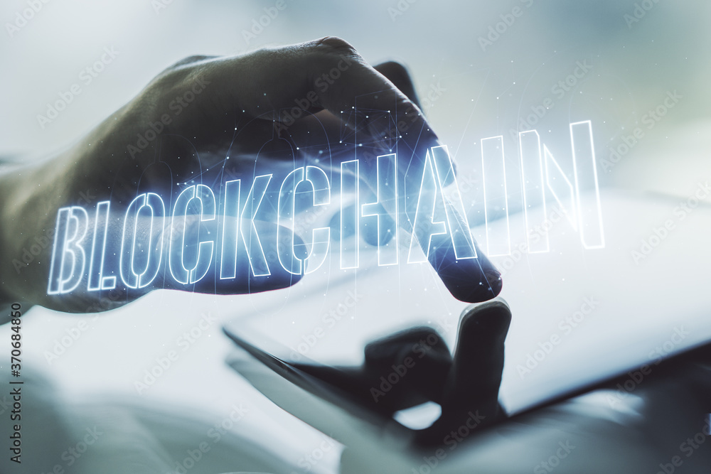 Poster double exposure of blockchain technology hologram and finger clicks on a digital tablet on backgroun