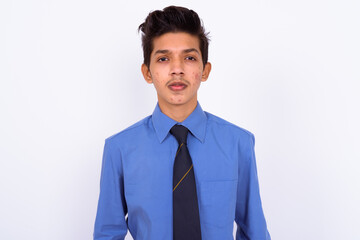 Portrait of young handsome Indian teenage boy as businessman