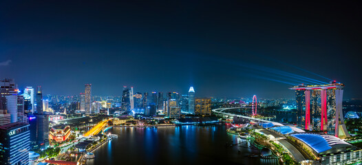 Fototapeta na wymiar Wide panorama image of Marina Bay area in Singapore at night.