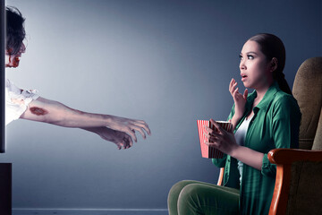 Asian woman scared with zombies coming out