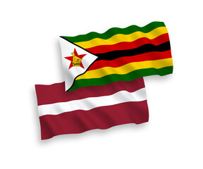 Flags of Latvia and Zimbabwe on a white background