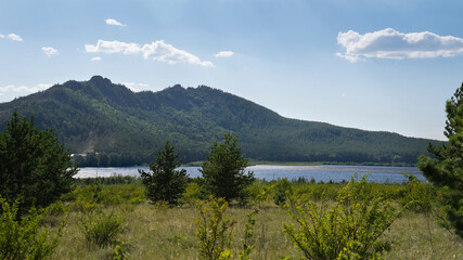 View of the lake in the mountains on a Sunny summer day