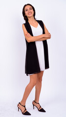 Portrait of happy young beautiful businesswoman against white background