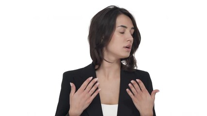 Portrait of young Caucasian woman taking off her jacket and waving hands near face because of heat or lack of air. Isolated on white background