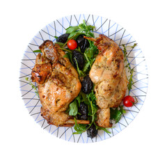 Baked rabbit with prunes on a plate isolated on white. Diet menu. Proper nutrition.