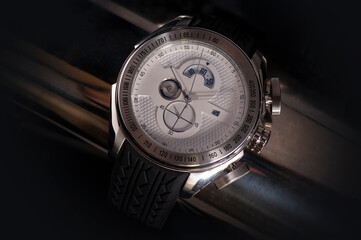 Elegant wrist watch closeup on dark
