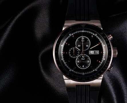 Elegant wrist watch closeup on dark