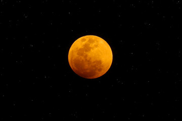 Blurred blood moon in the dark night.