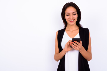 Portrait of happy young beautiful businesswoman using phone