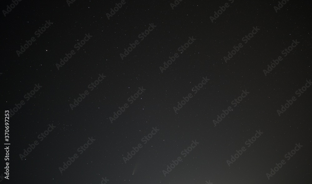 Wall mural widefield astronomical image showing comet neowise and the skies in the region of ursa major