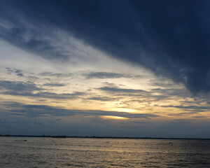 Sunset on the river. A beautiful reflection of the sun