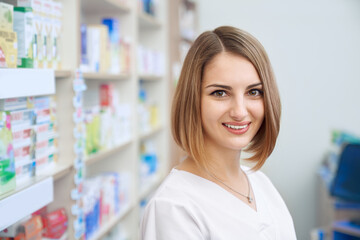 Female pharmacist posing in drugstore.