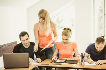 Fototapeta premium Students and teacher tutor in classroom