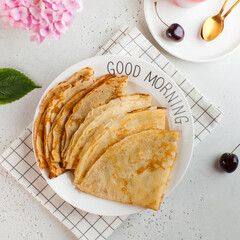 Delicious crepes on plates. Concept of Breakfast, dessert, recipe, French cuisine, Maslenitsa. Good...
