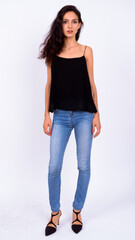 Portrait of young beautiful woman against white background