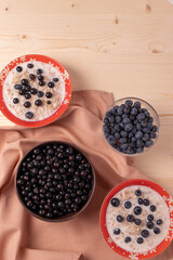 oat meal porridge as healthy organic vegan breakfast concept