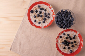 oat meal porridge as healthy organic vegan breakfast concept