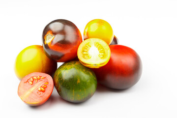 Background made from different tomatoes, white background