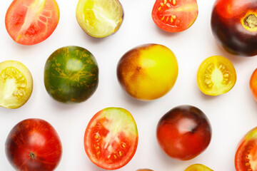 Background made from different tomatoes, white background