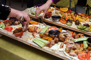 buffet with vegetables and meat