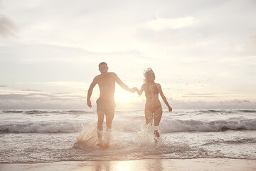 Fototapeta na wymiar loving couple on the beach / summer vacation, sea coast, love, romantic vacation at sea