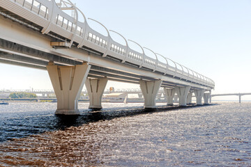 Metal structures under the bridge, large metal bridge over the water, details of the Western...