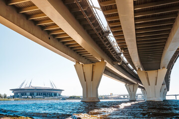 Metal structures under the bridge, large metal bridge over the water, details of the Western high-speed diameter in Saint Petersburg