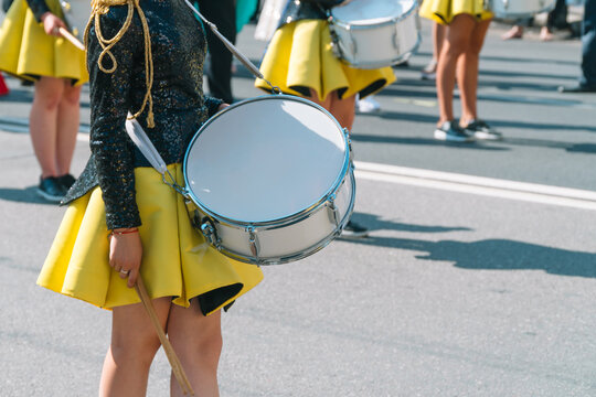Young girls drummer at the parade. Street performance