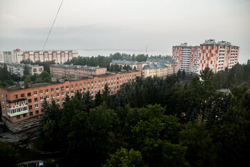 Foggy morning landscape in a residential area with apartment buildings