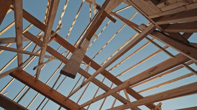 Abstract view looking up through the framing of a new home construction.