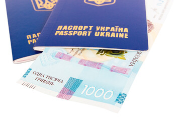 Two Ukrainian passports and one thousand hryvnias, isolated
